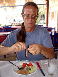 Tiny Doctor Tim demonstrates the correct method of eating Sardeles Pastes